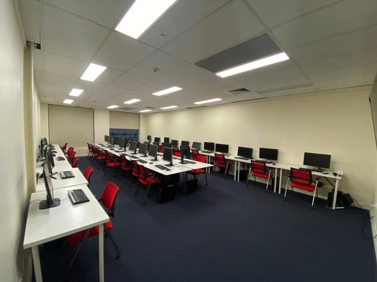 The LIHE computer lab from the back of the room: rows of desks and monitors